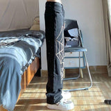 czarne jeansy z nadrukiem pajęczyny marki y2k